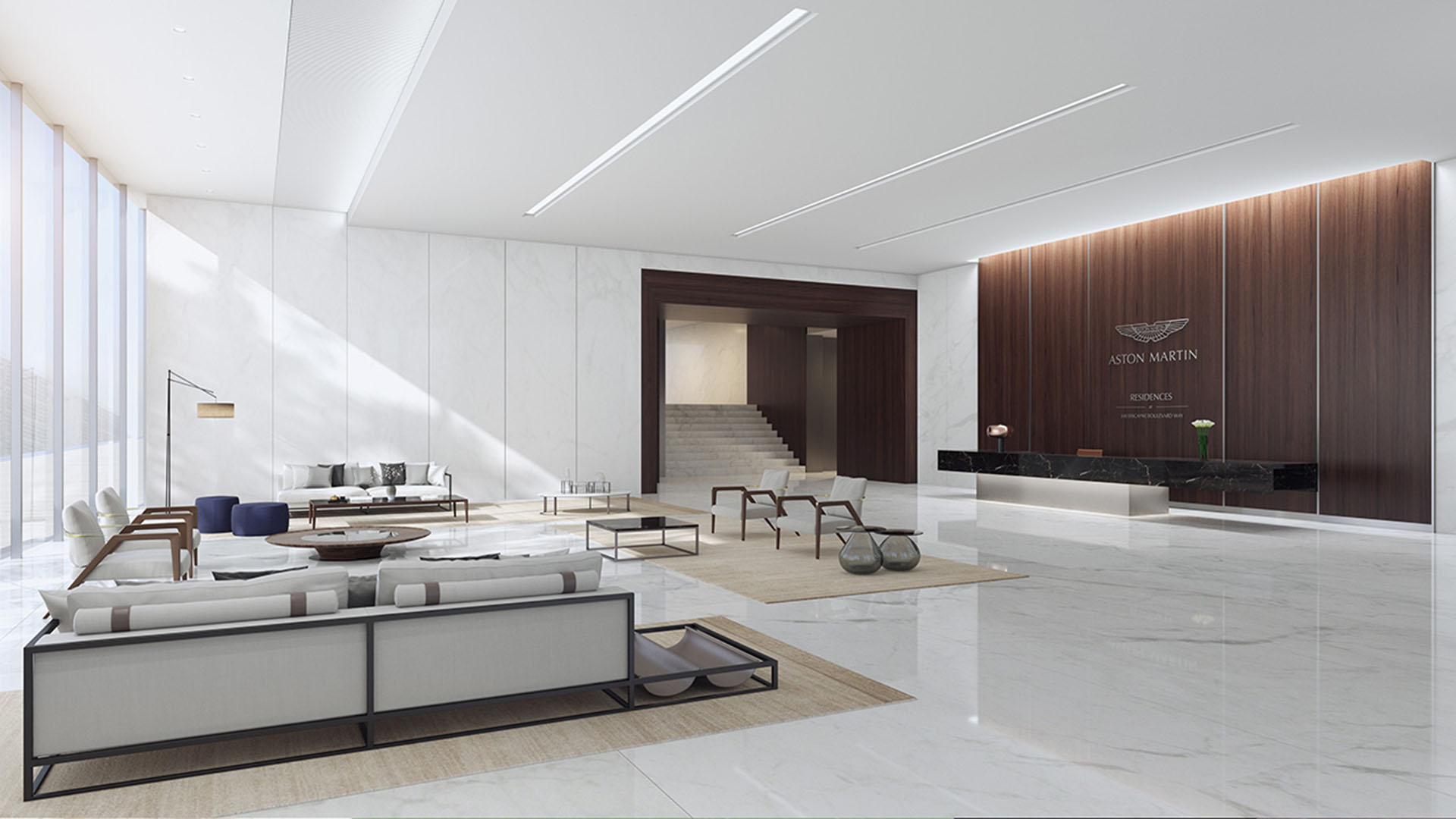 Aston Martin Residences in Downtown Miami luxury and ultra luxury condos grand lobby lounge with a black marble reception desk, wood paneling, and polished stone floors.