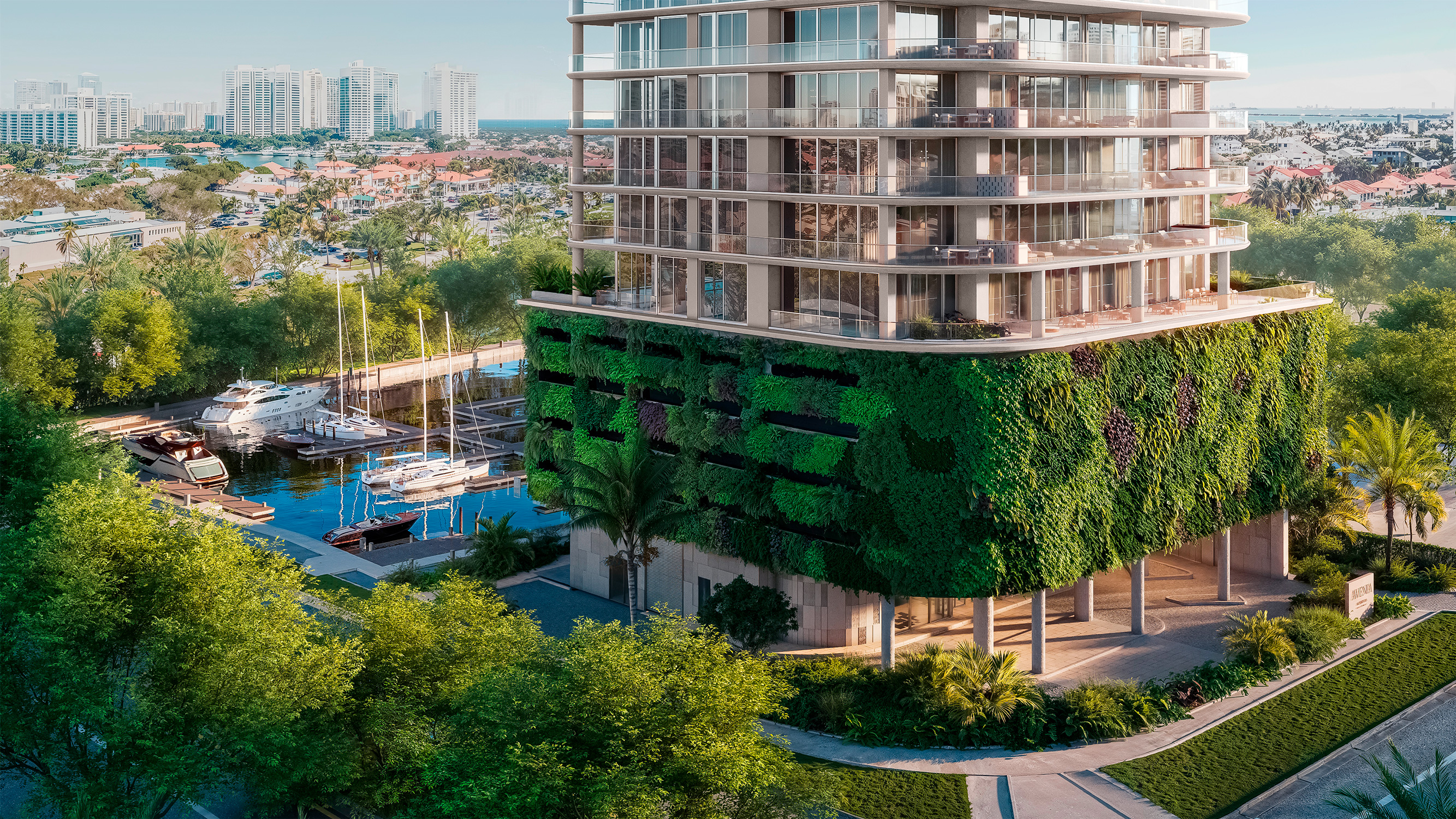 Avenia Aventura. Modern building with a green wall and balconies overlooks a marina with boats and a cityscape in the background. Featuring eco and friendly.