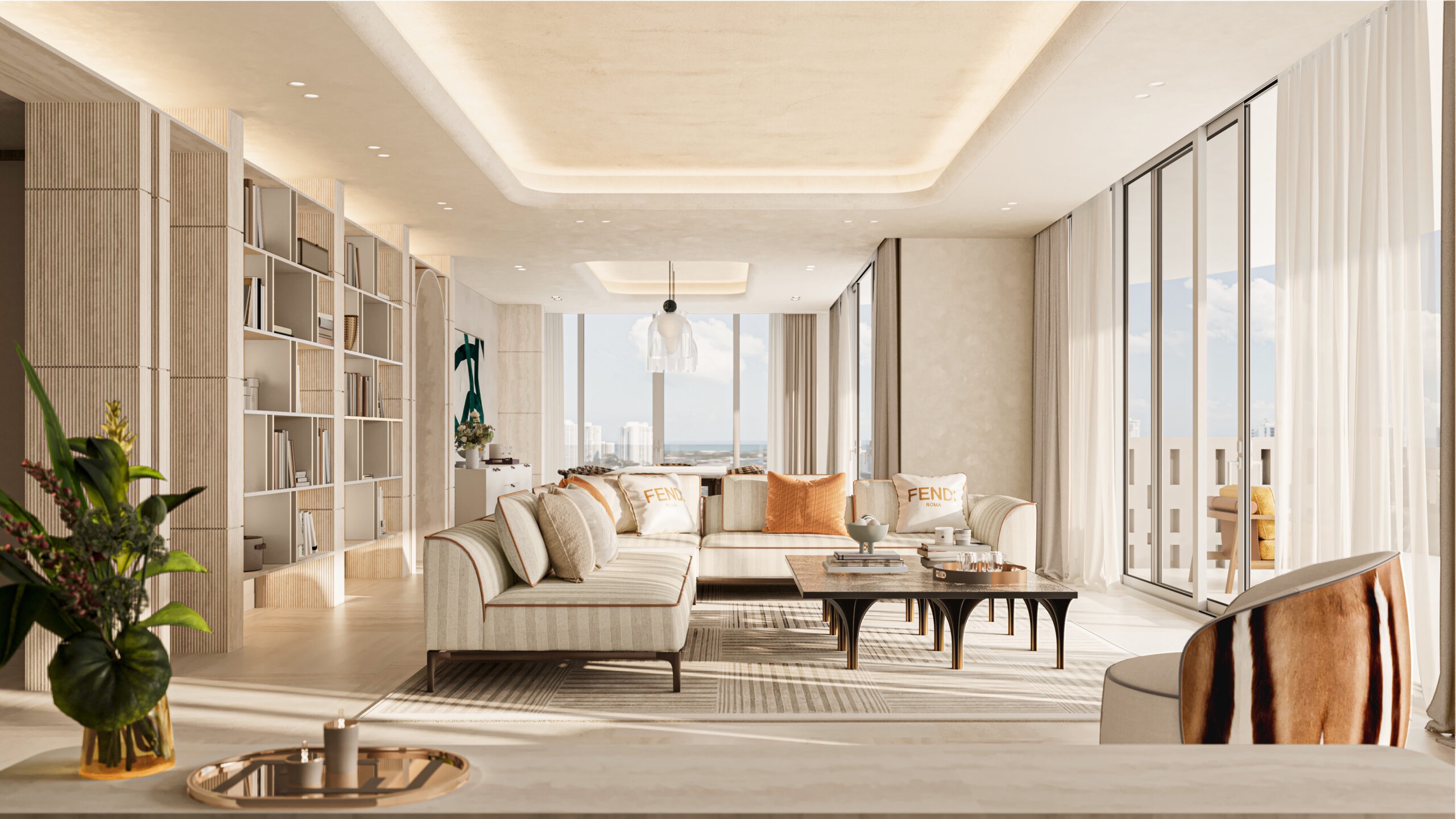 Avenia Aventura. Modern, sunlit living room with cream sofas, a coffee table, bookshelves, large windows, and city views in a neutral color palette. Featuring interior design.