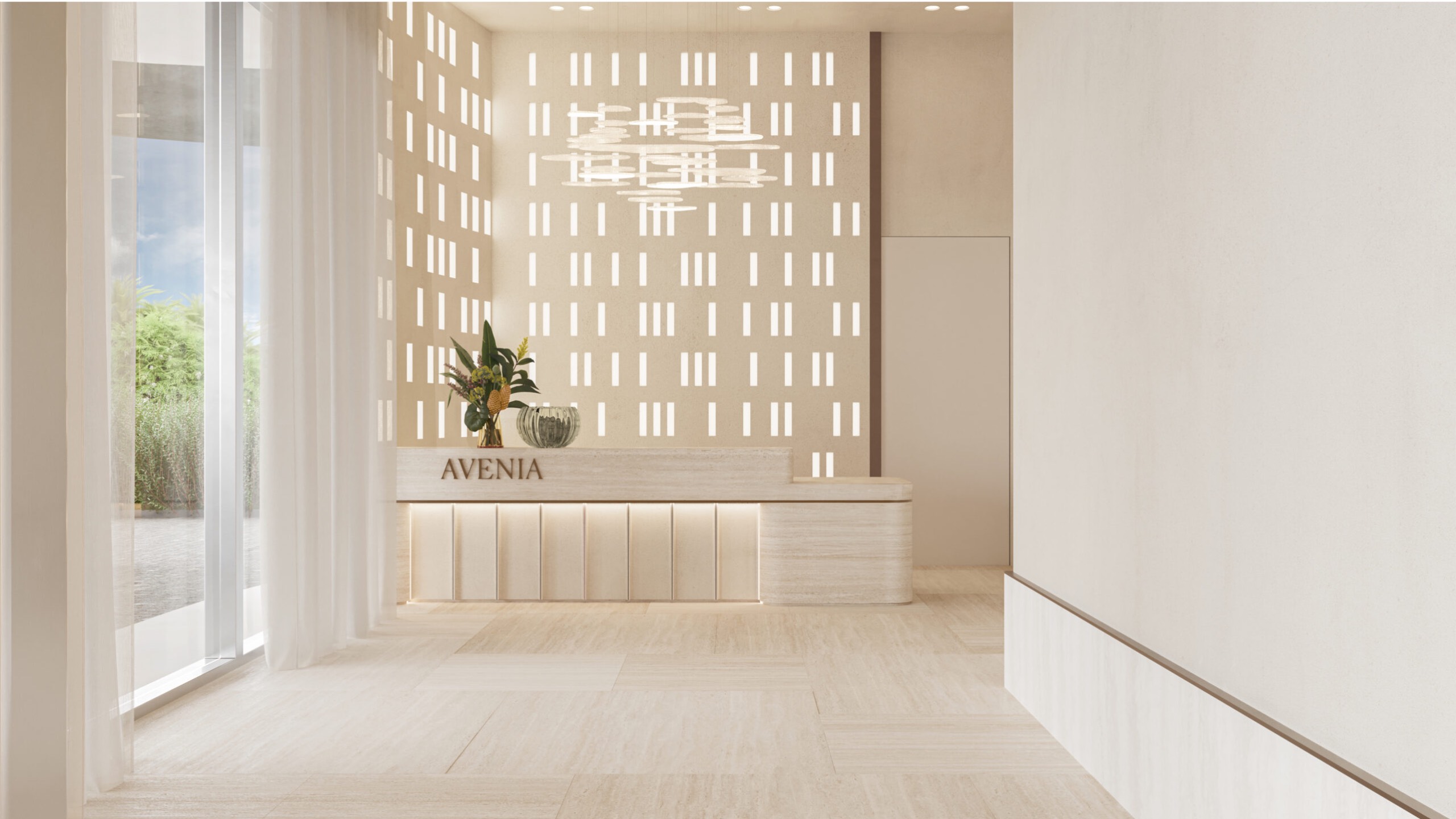 Avenia Aventura. A minimal, modern lobby with neutral tones, a plant on the reception desk labeled AVENIA, and patterned light filtering in.