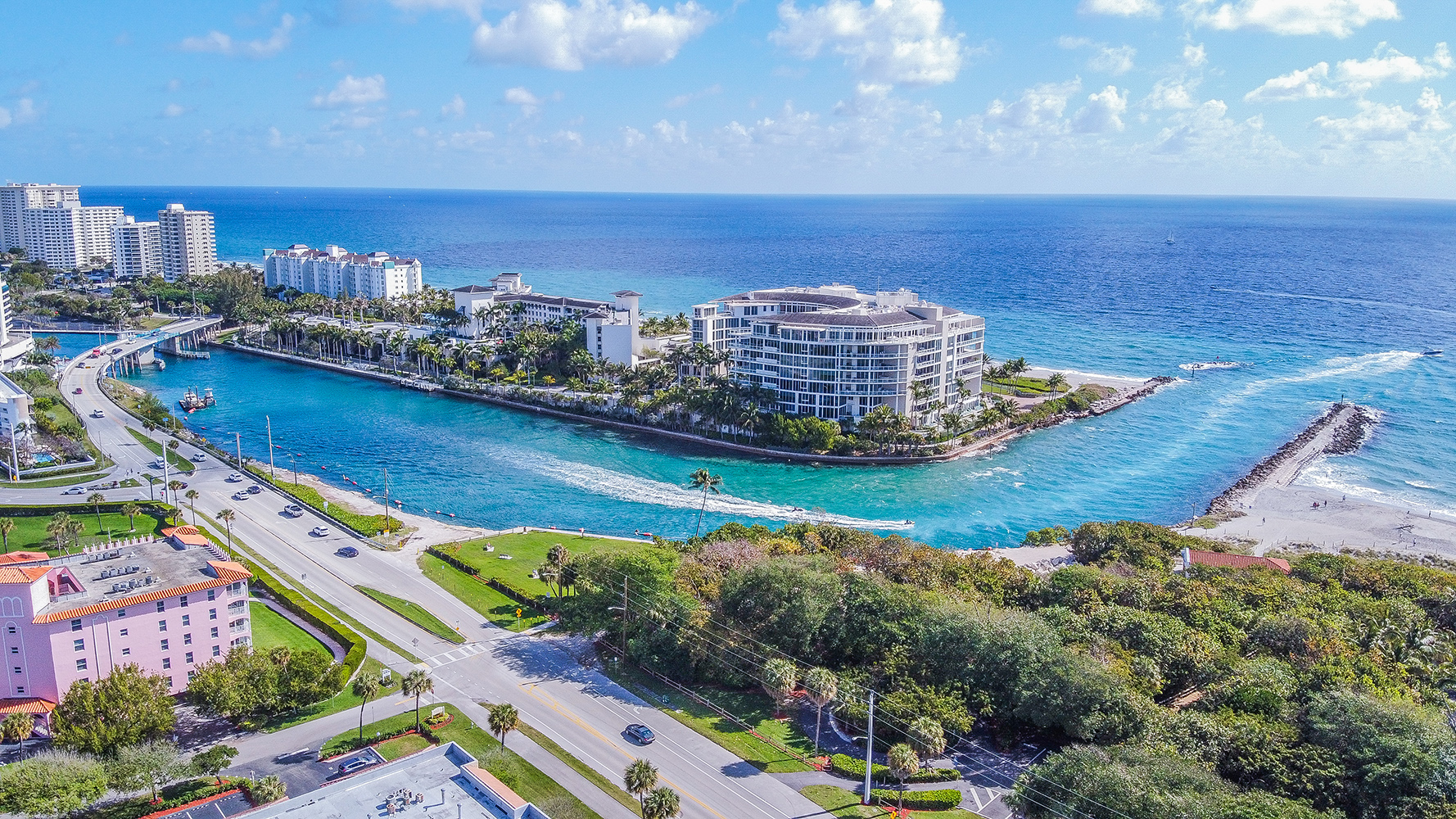 Boca Raton, South Florida marina and residential coastline seen from above, surrounded by palm-lined neighborhoods and luxury condos; ultra luxury, preconstruction and resale opportunities.