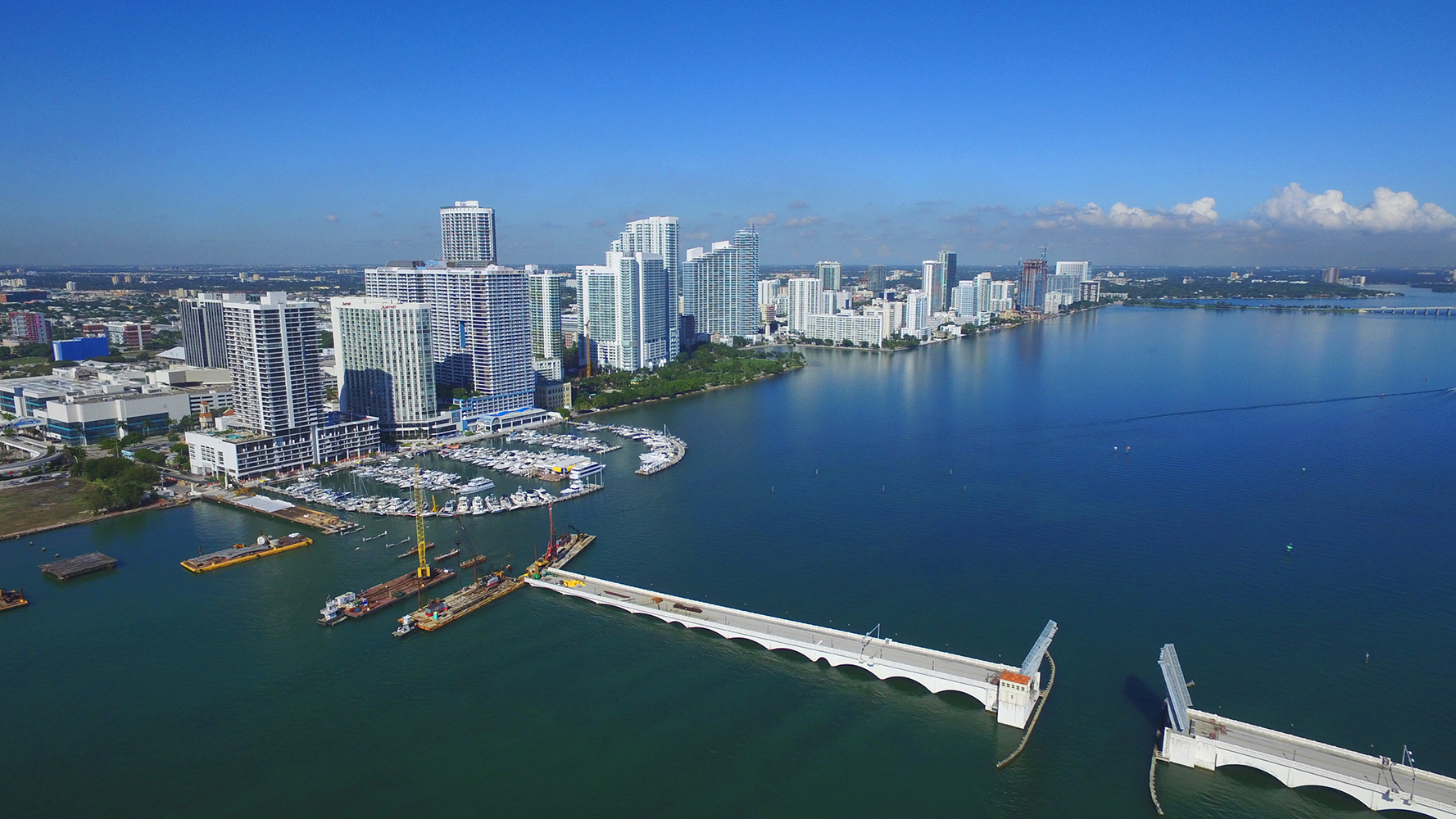 Edgewater, Miami marina view with yachts and skyline, prime neighborhood for luxury and ultra luxury condos, preconstruction and resale.