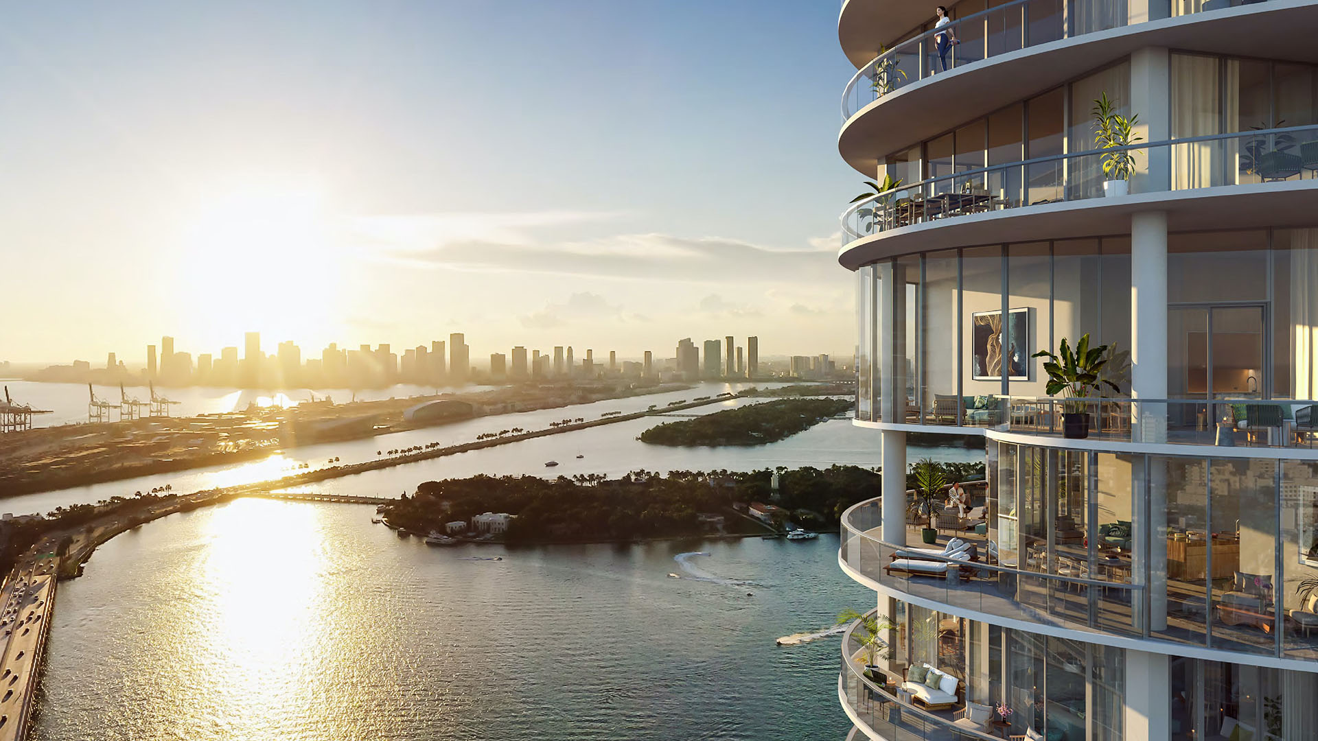 Tower edge and rounded balconies at Five Park in Miami Beach, luxury and ultra luxury condos with a sweeping sunset water view and skyline across the bay.