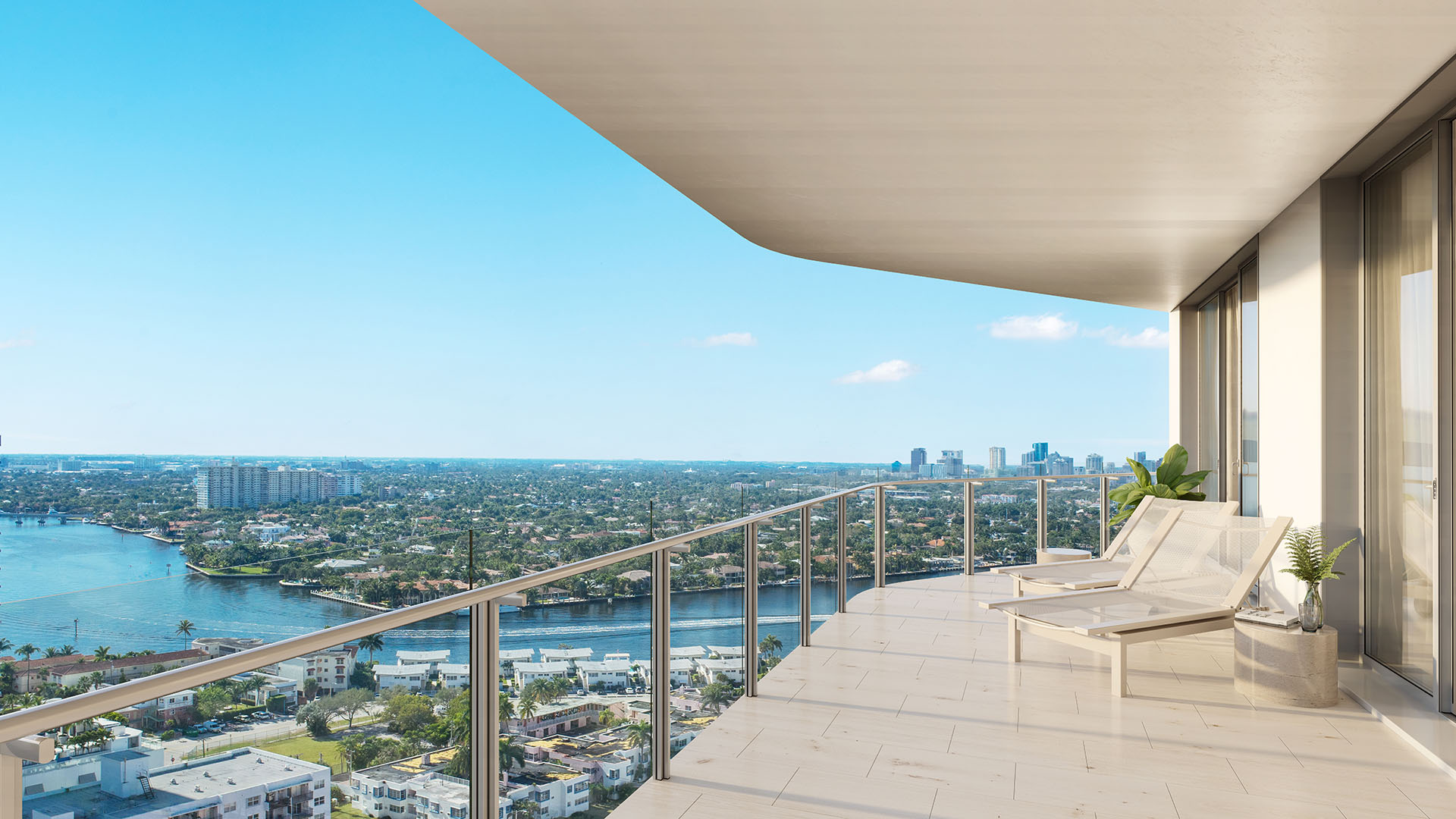 Wide private terrace with chaise loungers and Intracoastal skyline views at Four Seasons Residences Fort Lauderdale in Fort Lauderdale, showcasing luxury and ultra luxury condos with elevated outdoor living above the waterway.