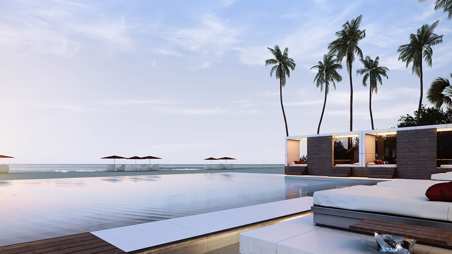 Infinity pool terrace with palm trees, loungers, and waterfront cabanas at Muse Residences in Sunny Isles Beach, complementing luxury and ultra luxury condos.
