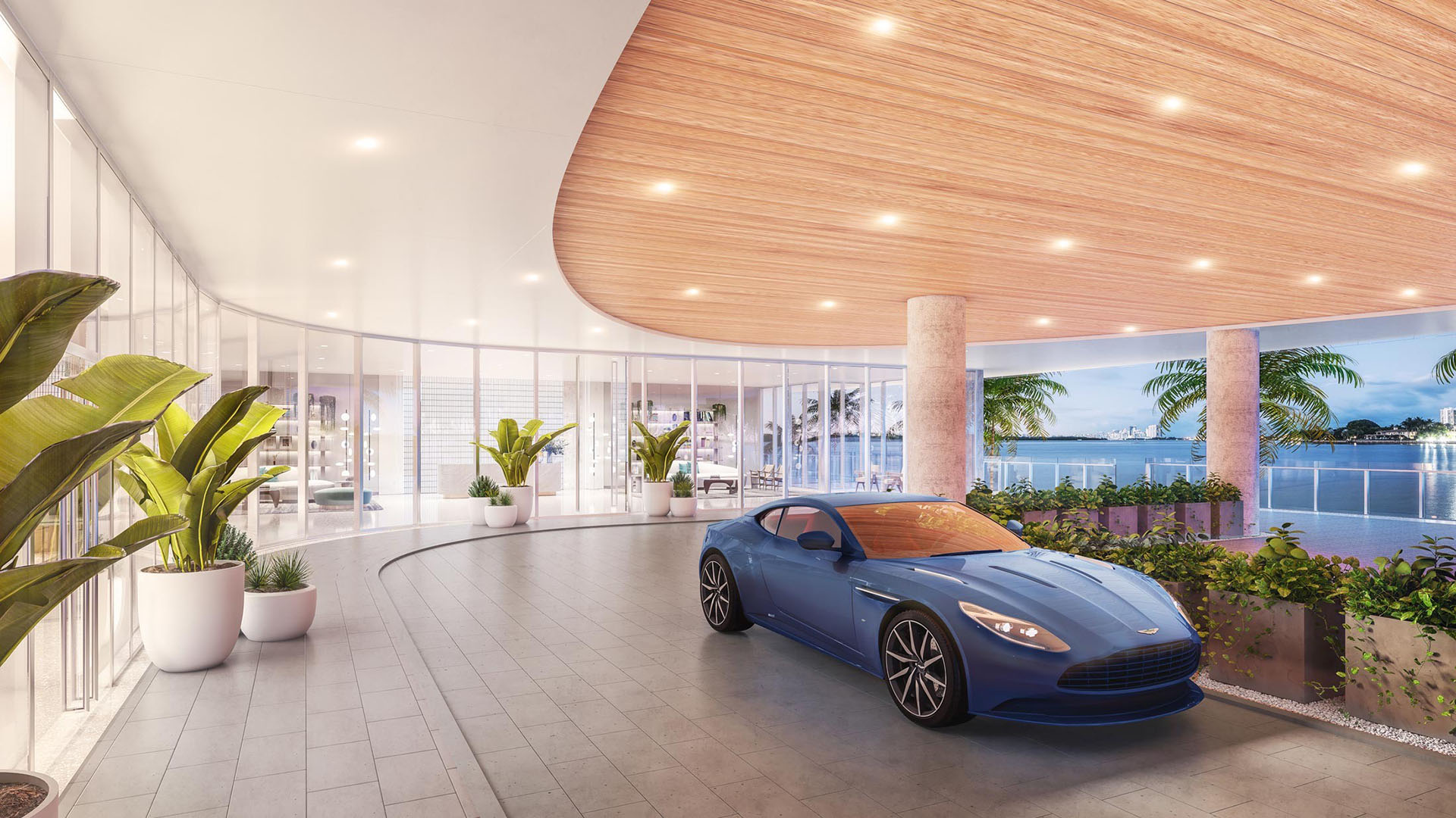 Onda Bay Harbor porte cochere arrival in Bay Harbor Islands, Miami, Florida with curved canopy, glass lobby and luxury car drop-off overlooking the bay-ultra luxury preconstruction condos entrance.