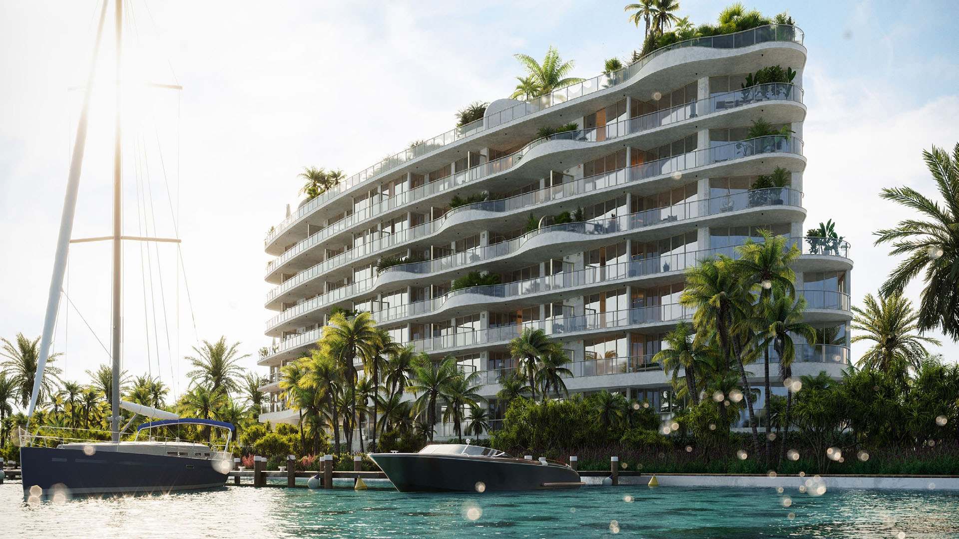 Waterfront exterior of Onda, Bay Harbor Islands, Miami, Florida, with signature curved glass balconies, tropical landscaping and yachts, showcasing luxury and ultra luxury preconstruction condos.