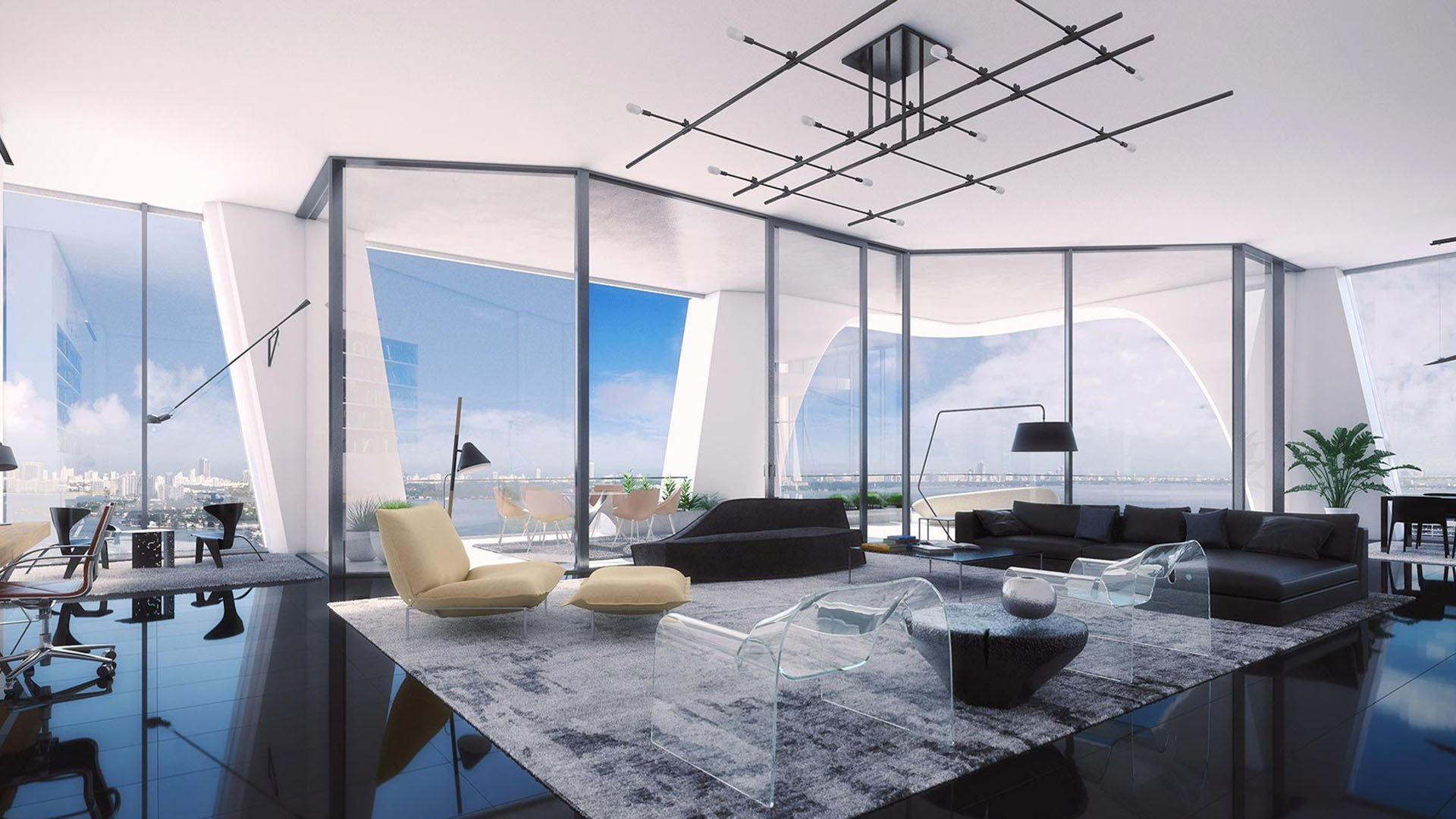 Open-plan living room at One Thousand Museum in Downtown Miami with a home office nook and broad waterfront views for luxury and ultra luxury condos.