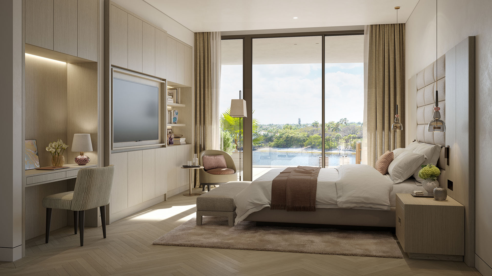 Rosewood Residences Hillsboro Beach, Florida primary bedroom suite with king bed, built-in TV wall, work desk and floor-to-ceiling glass opening to balcony water views, showcasing luxury and ultra luxury preconstruction condos.