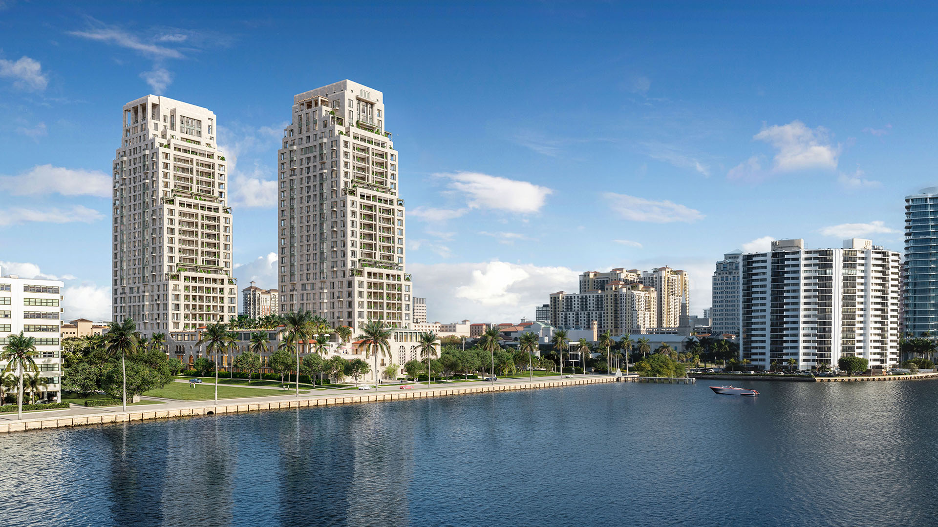 Daytime waterfront skyline view of the twin towers at South Flagler House in West Palm Beach, presenting luxury and ultra luxury condos with a prominent position along the water.