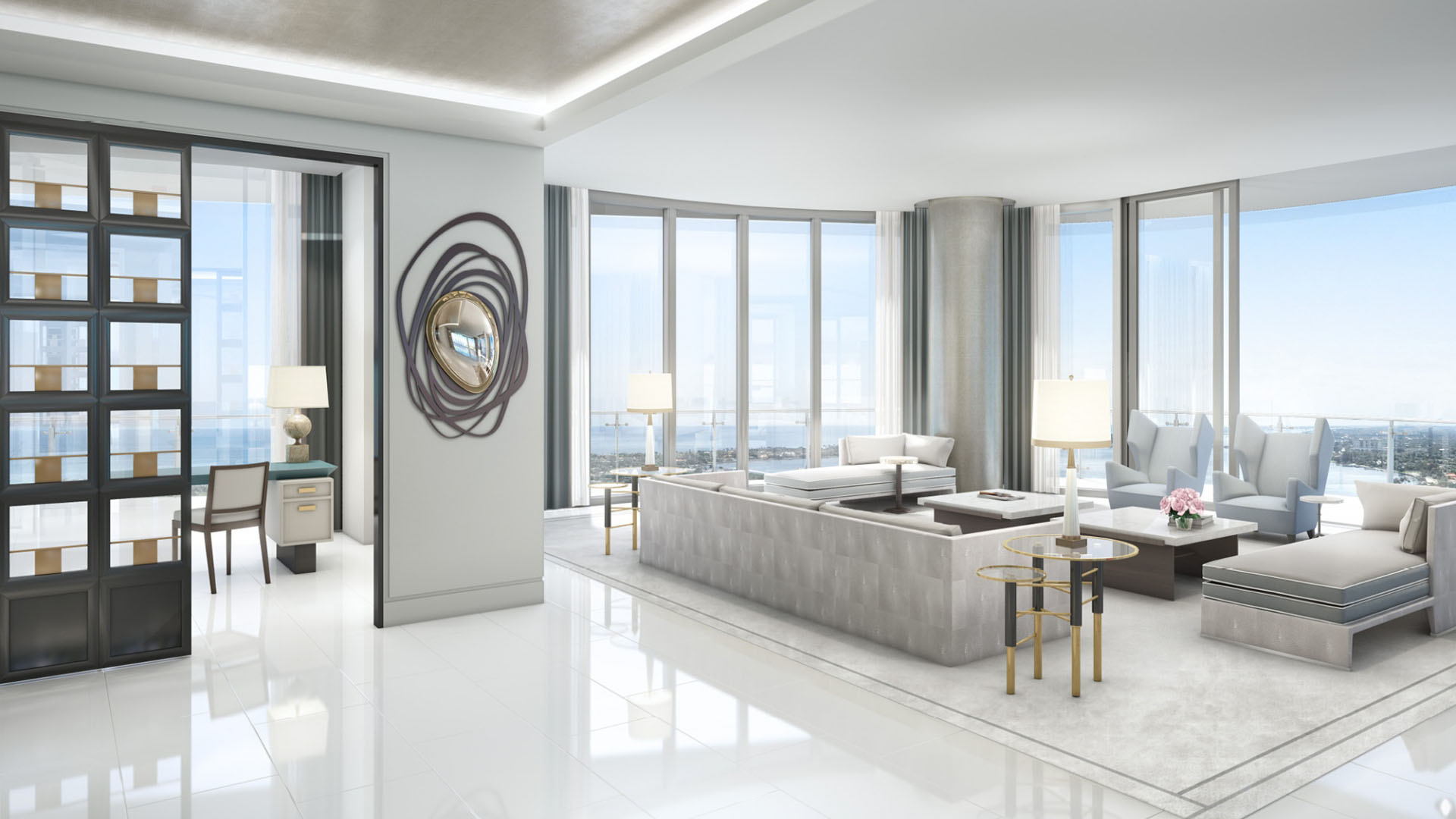 Living room with wraparound floor-to-ceiling windows and water views at The Bristol Palm Beach in Palm Beach, expressing the spacious style of luxury and ultra luxury condos.