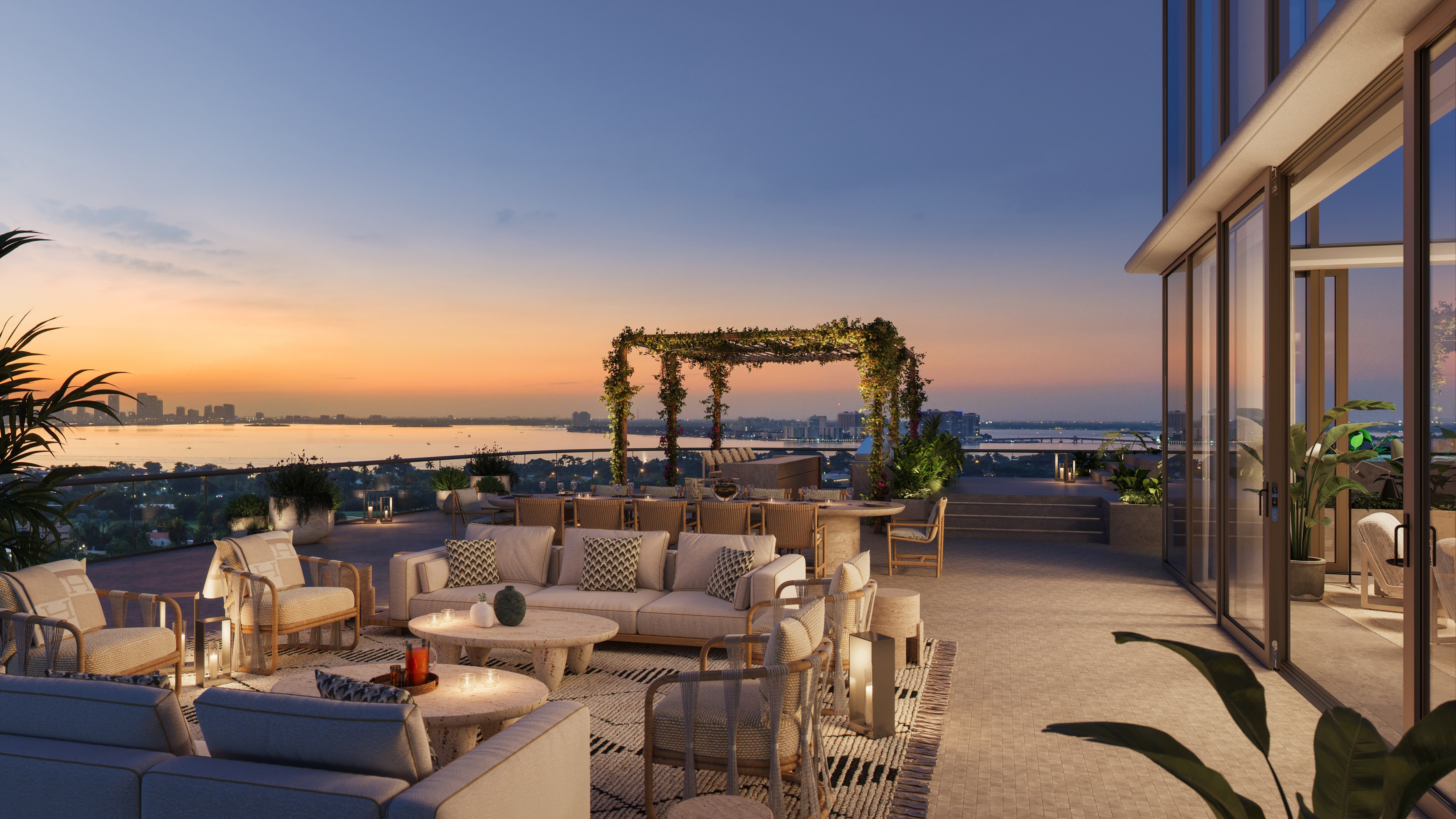 The Perigon Miami Beach rooftop lounge at sunset, skyline and ocean vistas for luxury and ultra luxury condos; preconstruction. Featuring view.