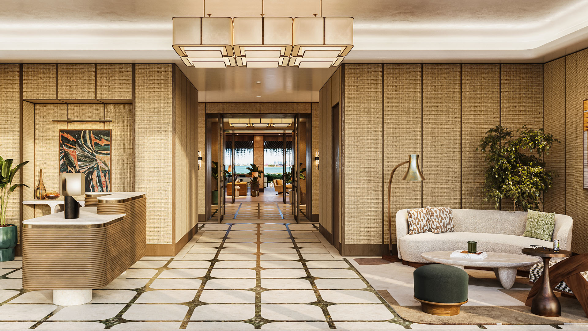 Grand lobby and reception at The Residences at Six Fisher Island, Fisher Island Miami Beach, Florida, featuring designer chandelier, concierge desk and lounge seating, setting the tone for luxury and ultra luxury preconstruction condos.