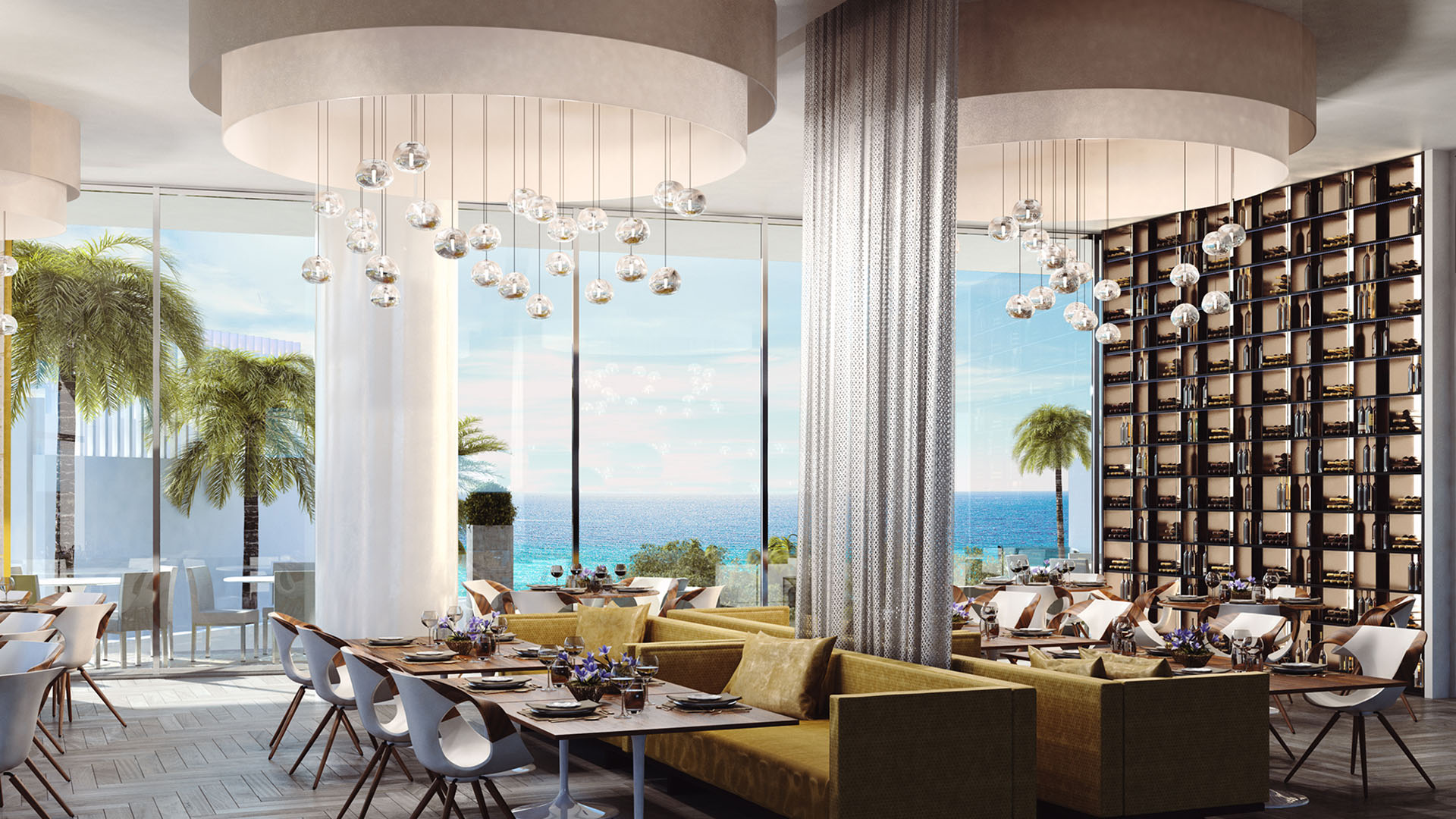 Turnberry Ocean Club in Sunny Isles Beach luxury and ultra luxury condos showcase an oceanfront lobby restaurant with banquettes, pendant lighting, and terrace dining beyond.